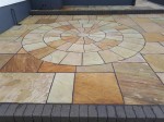 Layered patio with circular feature in natural stone by  GM Hard Landscapes, Donegal, Ireland